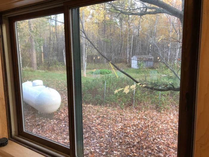 Bathroom window on the opposite side of the house from the first three. 