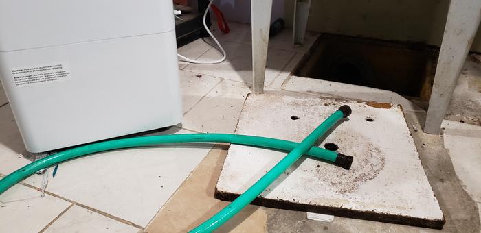 Humidifier, hose and drain cover with a larger hole drilled in