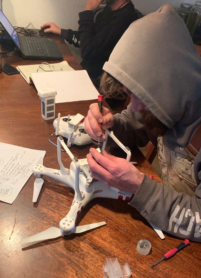 Josiah working on the camera drone to get aerial photos of the Lab