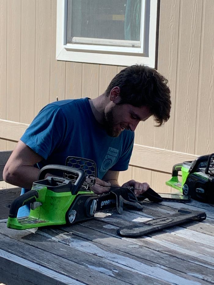 Dustin sharpening chainsaws