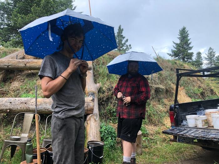 I hope it rains again so we can work in these umbrella hats again.