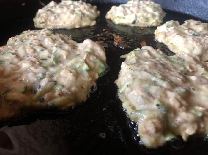 Zucchini cakes on a giant cast iron skillet