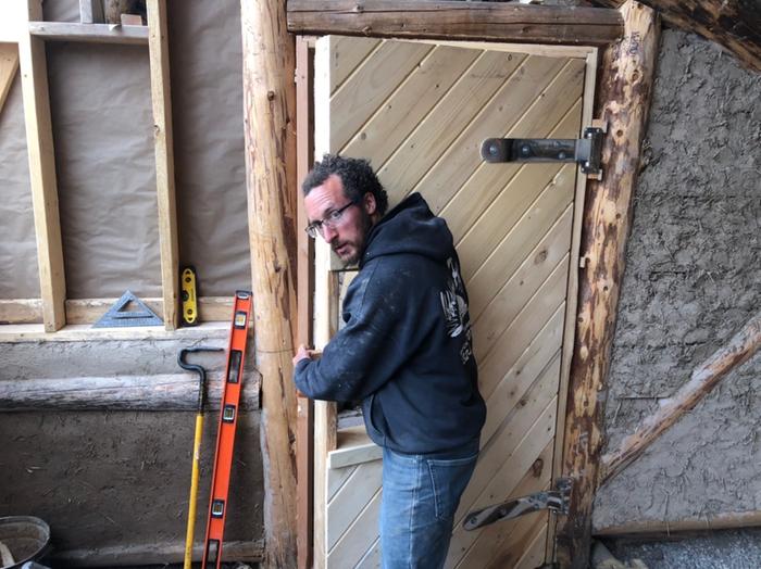 A man and his door. Look at those hinges