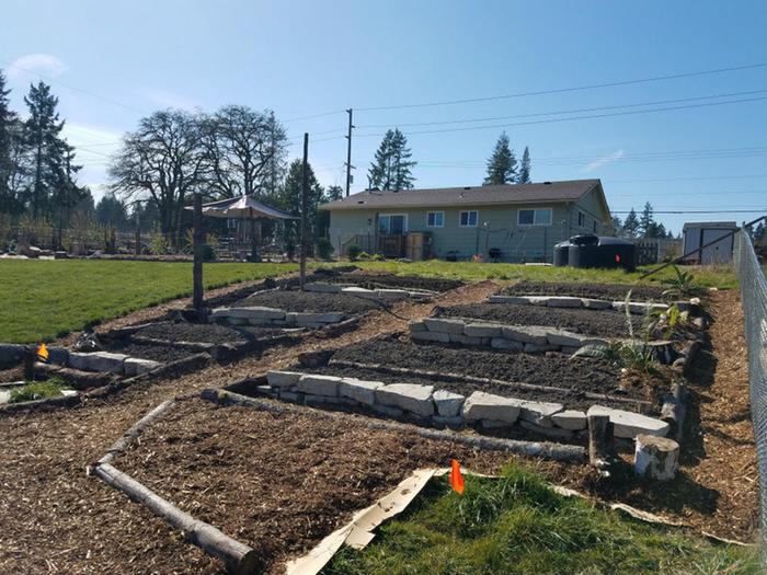 Brand new terrace garden for squash, melons, corn, carrots, onions and mixed greens plus flowers and some native plants.