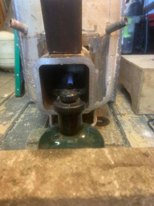 heating a rocket stove with a propane torch to slowly dry out the heat riser