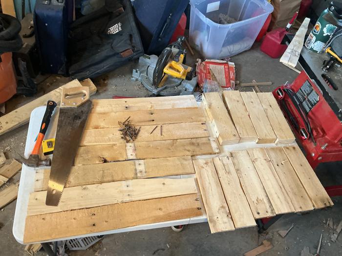 These are all of the materials and tools I used. All of the wood and nails you see are made from a pallet I recycled 