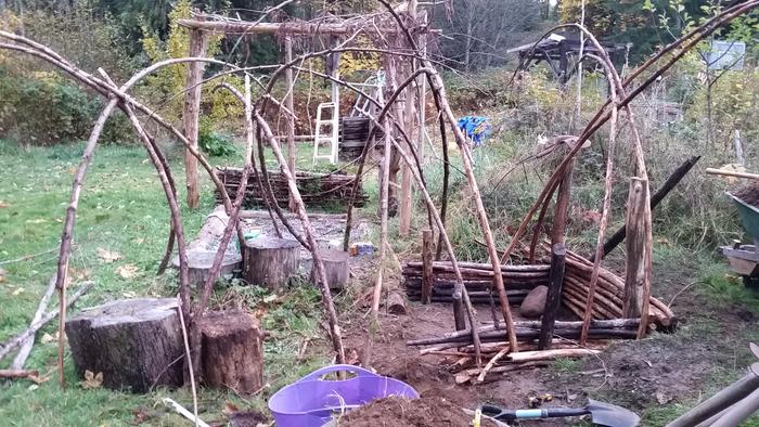 These are NOT secured. I threw them up to look at them. They're curvy cedar branches and I was thinking of using them either to aid in support along the beam, or to go on top of it as a scaffold for debris