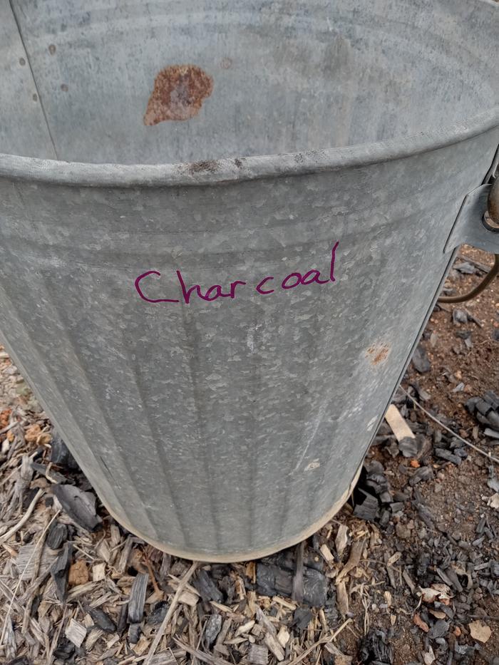 The metal charcoal bucket