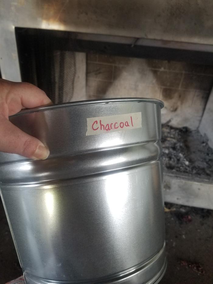 labeled metal bucket 