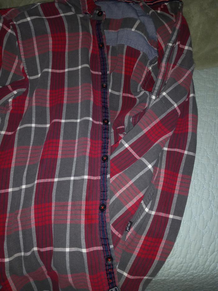 Shirt with buttons.