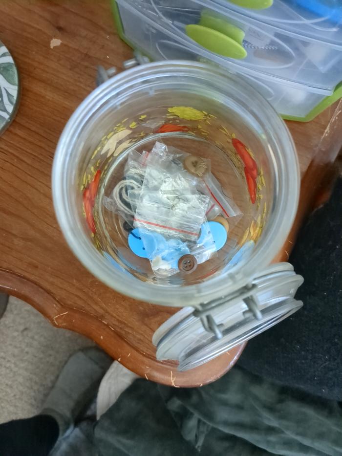 Putting the button in this jar I found laying around.