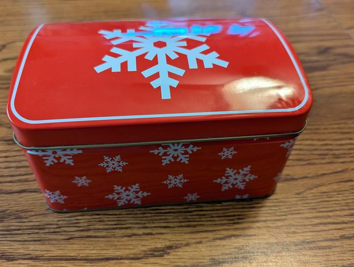 metal box decorated with snowflakes