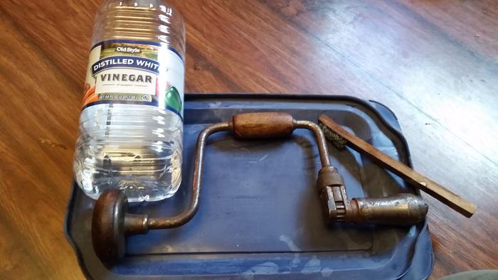 Vinegar and steel brush to scrub off the rust