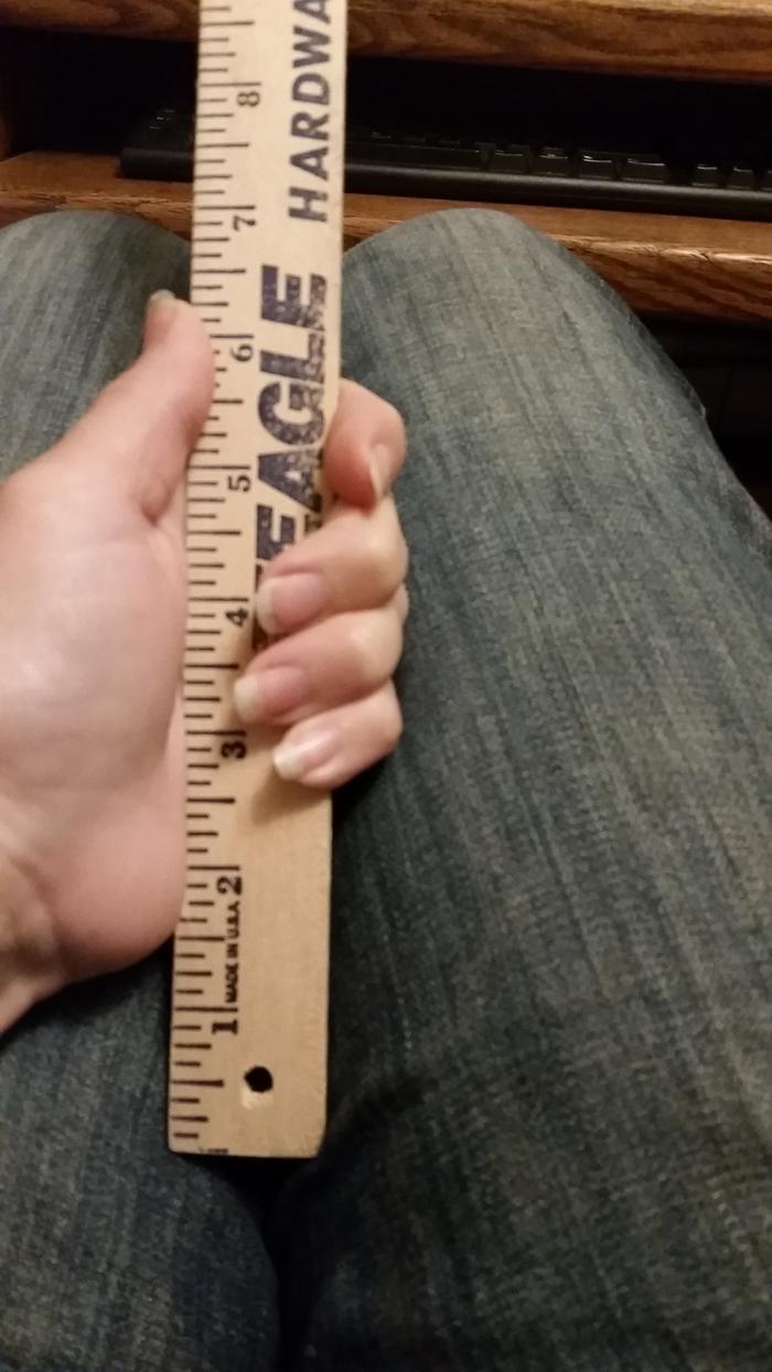 And, here I am holding a ruler, showing the pouch would have been at least 6 inches tall when held in the same position