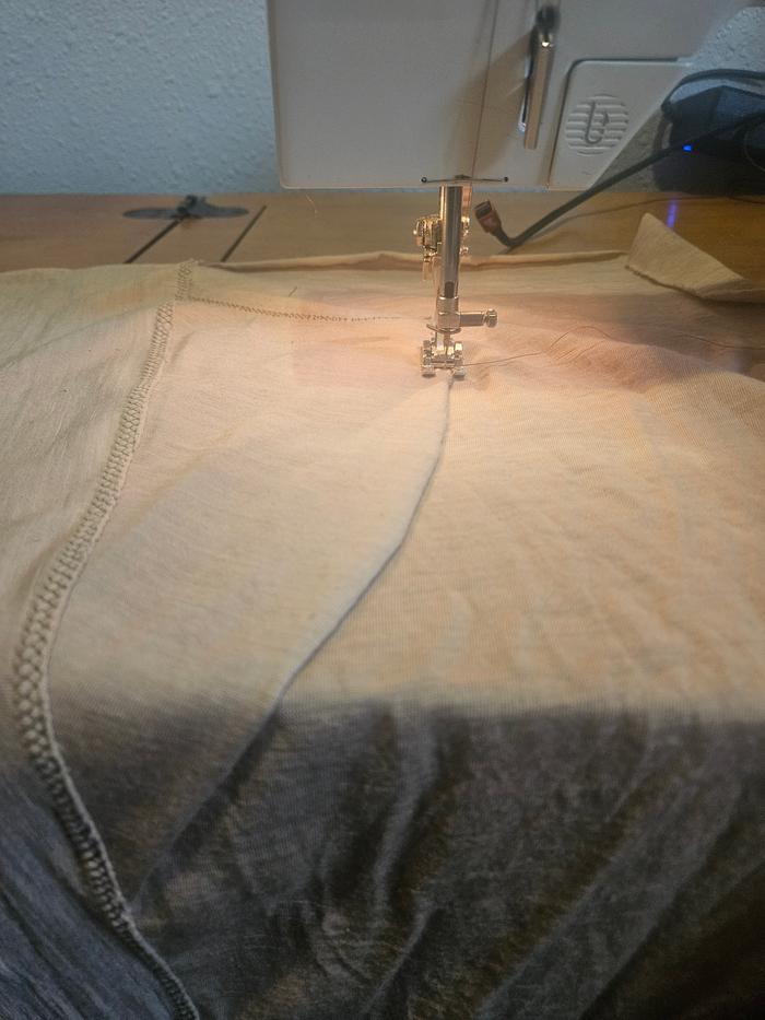 Sewing on a pocket. Because pants are nearly useless without pockets!! 