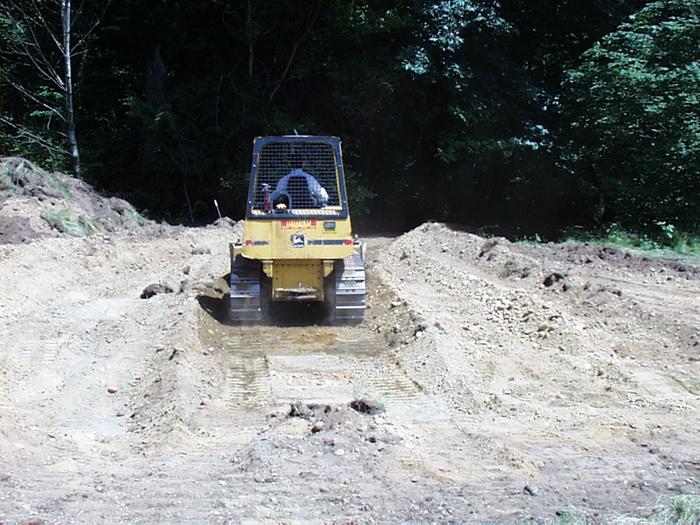 Bulldozing into a bend in the driveway.