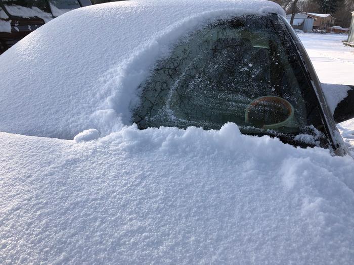 car buried in snow