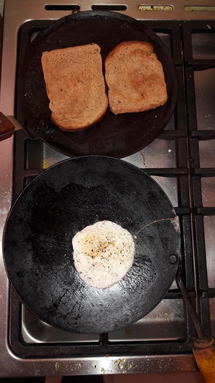 Making toast on an iron chapatti pan