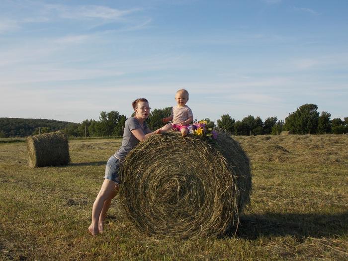 child on haybale