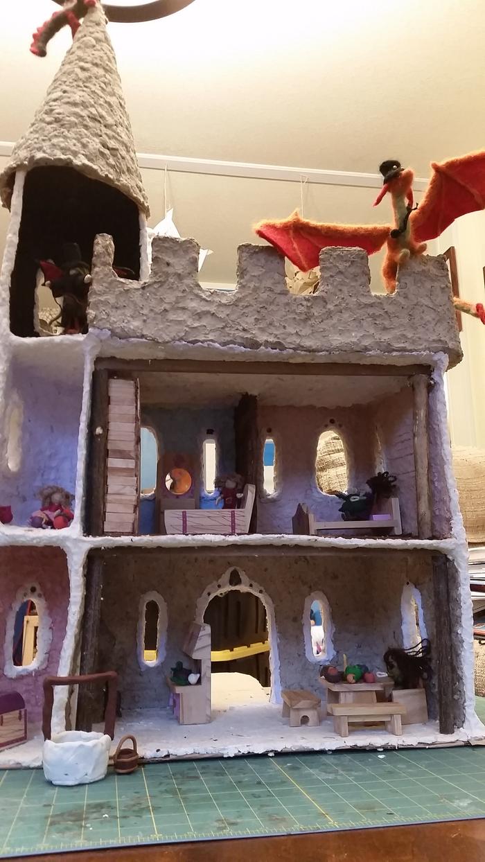 handmade castle with waldorf dolls and mellissa doug furniture