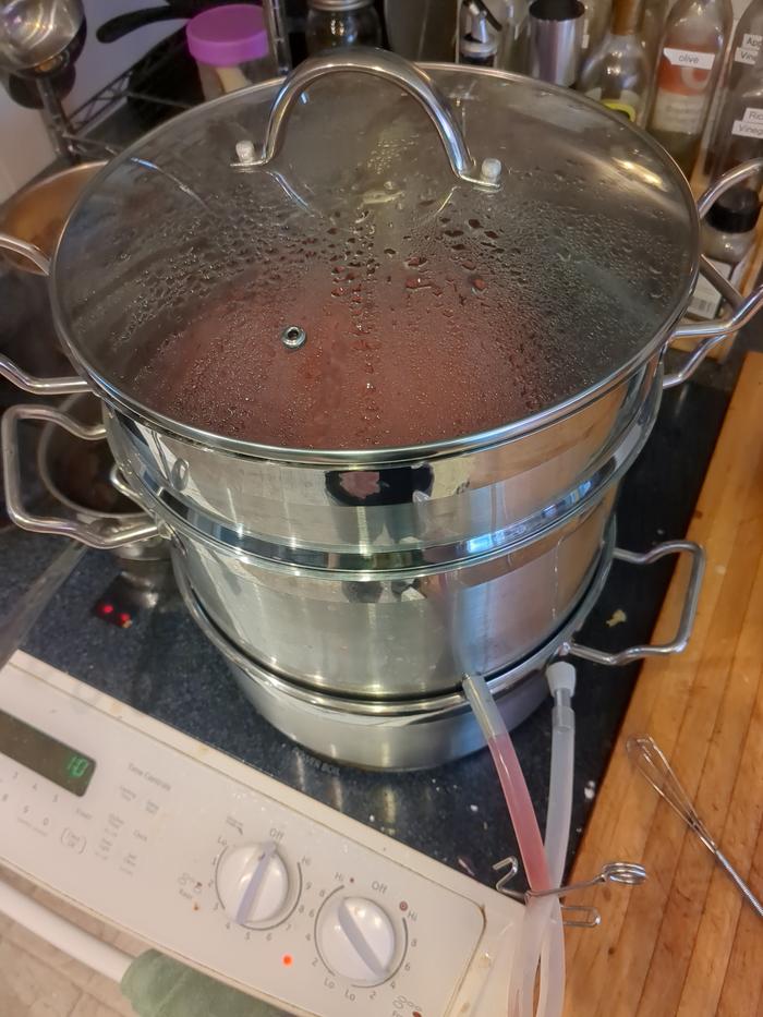 Making mixed berry juice in the steamer.