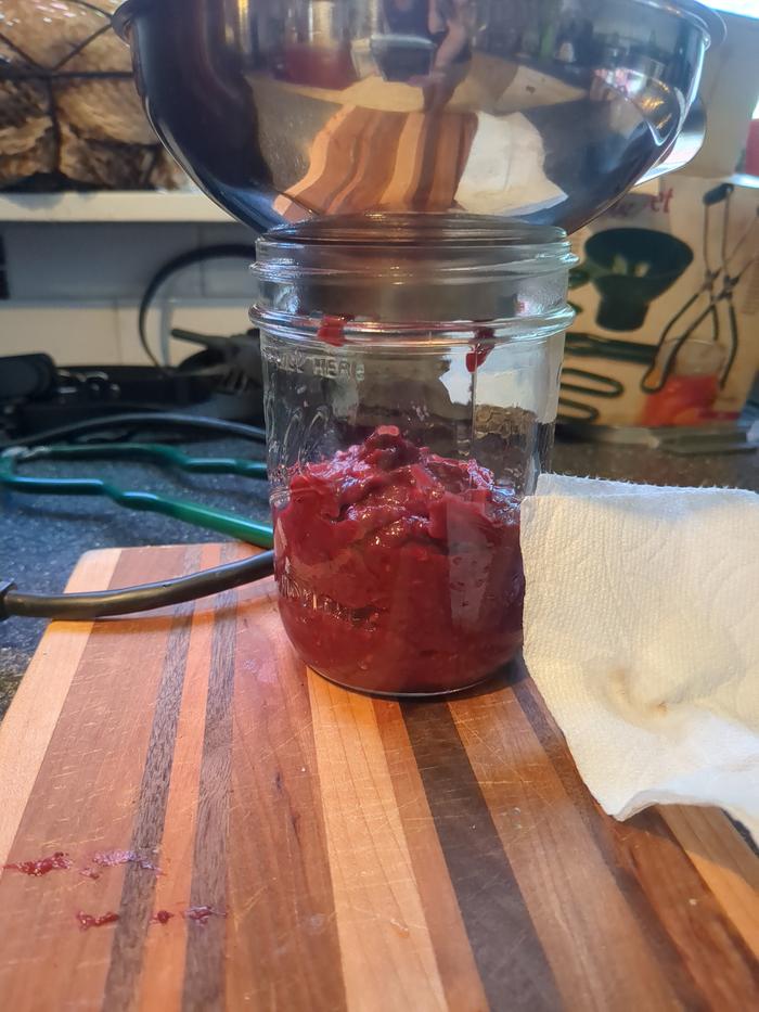 Filling the pint jar. 