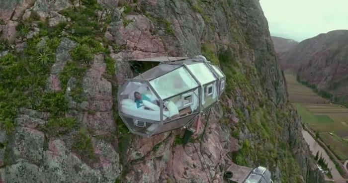 sleeping pod on side of cliff