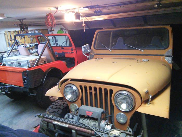 Two current jeeps taking up room in the shop/garage. Picture is a few years old, but it looks the same today