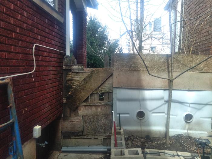 My bootleg fence(due for reconstruction).The bed is there in front.