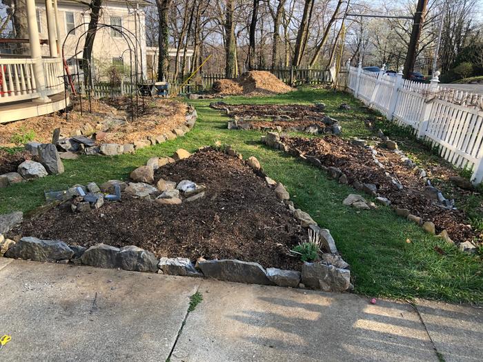 rock-edged-triangular-garden-beds