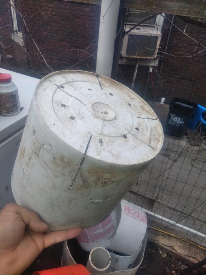 Take bucket, invert it and cut some slots.