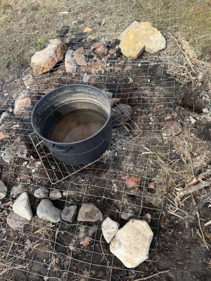 Once I’d collected as much as I could over the course of about 2 weeks, I used our fire pit with some old wire fencing and an oven grill to hold up the biggest pot I own.