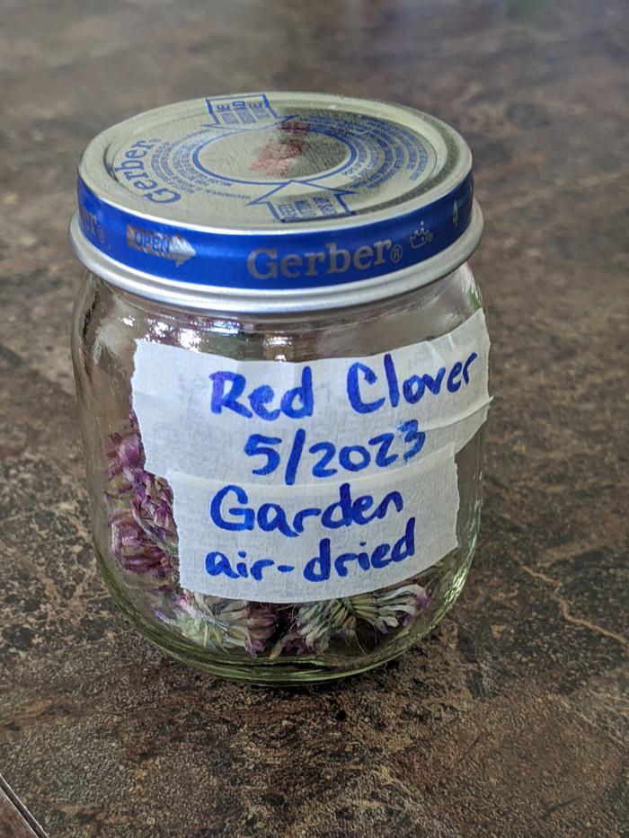 Dried blossoms in their labeled jar