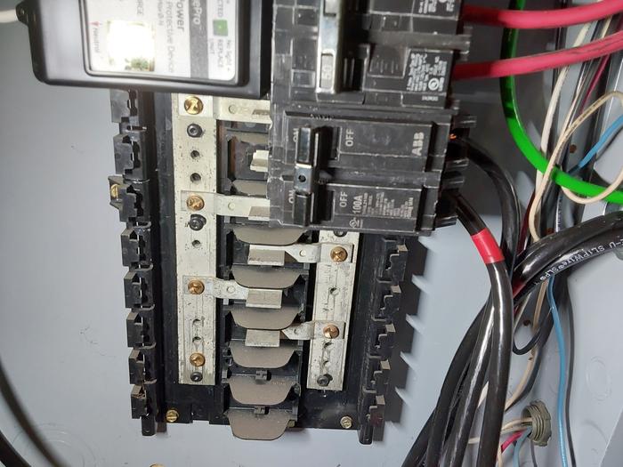 100 amp breaker installed with both L1 and L2 hot wires (after everything is running, so it's on) 