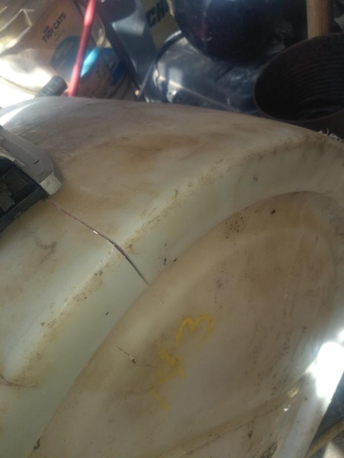 Split in half 30 gallon drum, inverted and slotted for water infiltration. 