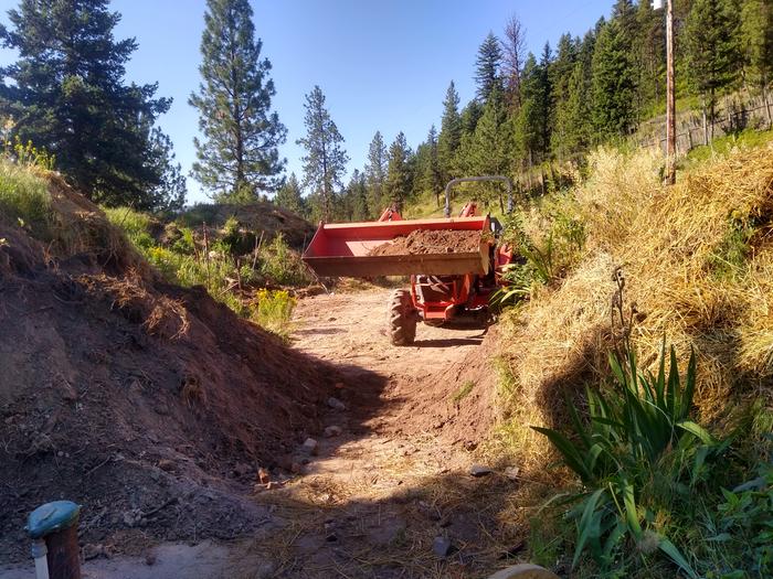 Scott moving the berm back into place