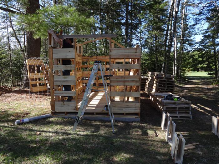 Adding the higher bit on the west side. Support for the beam and door frame is installed.