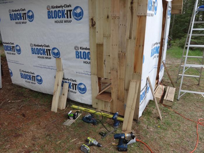 Chicken door plus siding going on (installed by the missus)