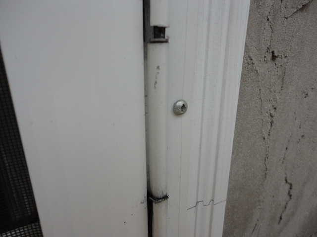 Here is a close up of one of the aluminum hinges showing how it has been worn away over time causing the whole door to drop down in level.