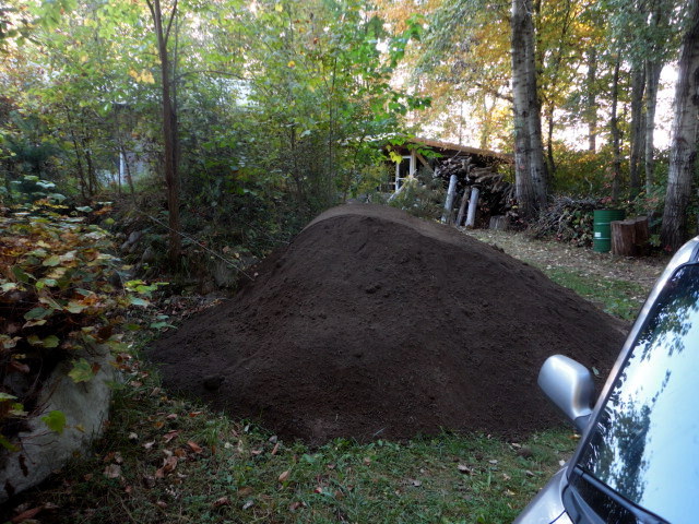 10 yards of screened topsoil arrived for the roof.