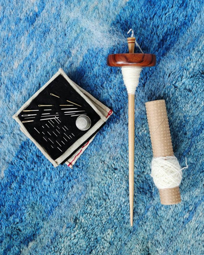 drop spindle, sewing kit, wool thread