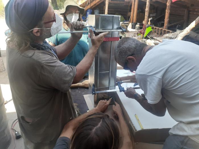 Covering a heat riser with scrap ducting 