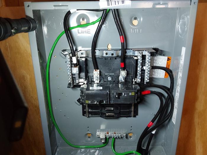 100 amp sub-panel further along - both inverter breakers are in, although initially only the right one was put into service 