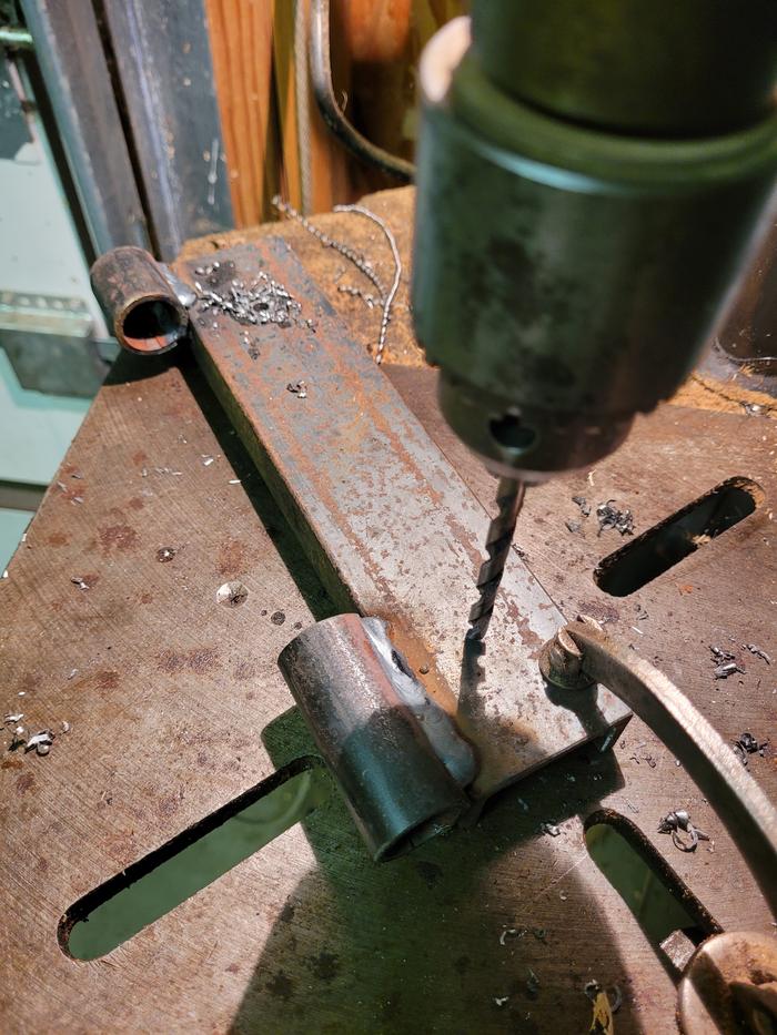 Drilling bolt holes.