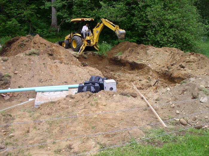 Excavating leach field.