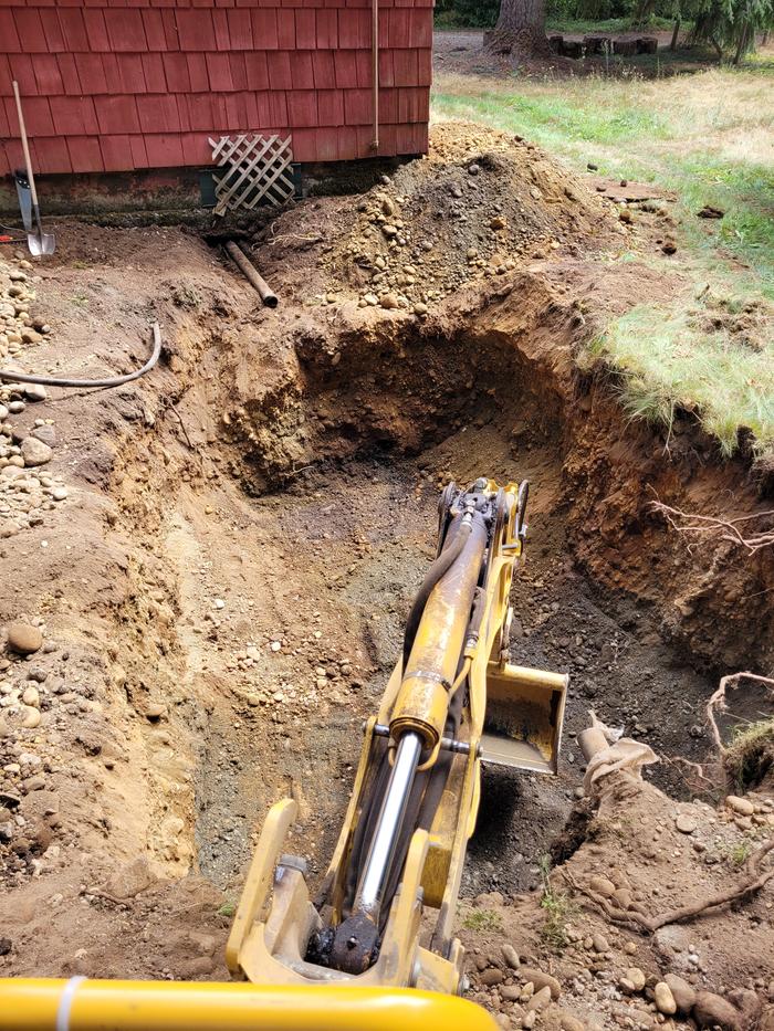 Old tank removed, hole dug for much larger new tank.