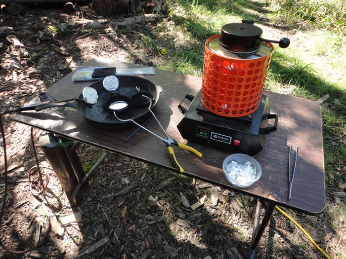 This is my equipment all set up outside on a table. I'm using an electromelt furnace with a graphite crucible inside.