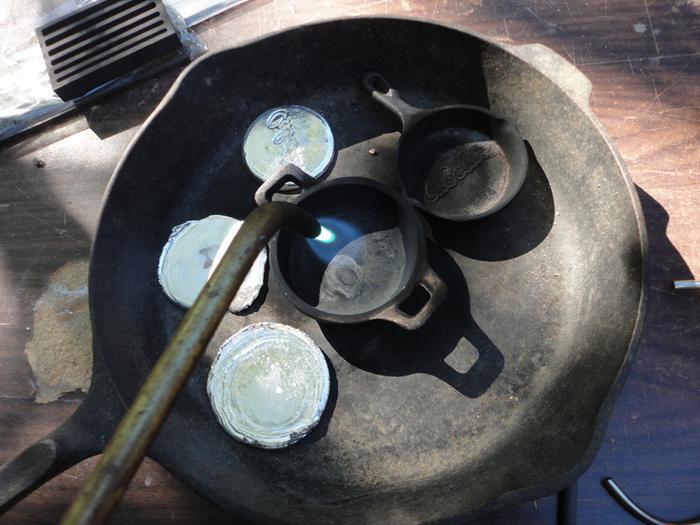 I'm prepping the pan with my acetylene torch. First heating it up some to make sure all moisture is gone. That's very important!