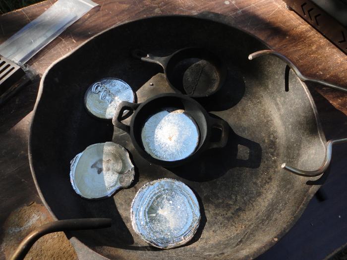 I do keep the torch on the crucible as I pour to make sure the metal doesn't solidify as I pour. In this shot I've done the pour.
