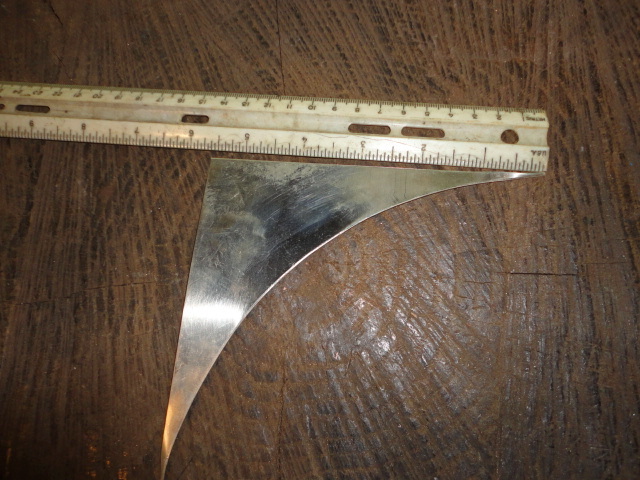 My initial scrap of sterling silver sheet with a ruler to help gauge size.